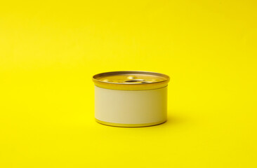 Tin can of canned food with white label on yellow background, mockup for your design
