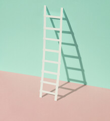 Paper ladder on a blue-pink pastel background. Creative layout, business, career growth concept
