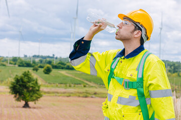 engineer worker man drinking water summer hot day. Tired worker finished work. Thirsty. Working outdoor location.