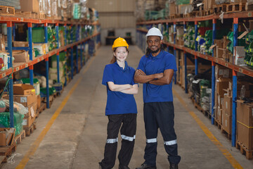 Worker in cargo warehouse teamwork support trainee young women with African foreman help together