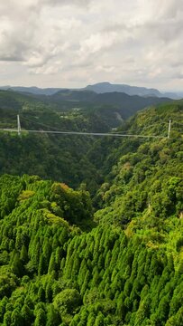 Aerial view of Kokonoe Yume Otsuribashi Bridge and Naruko River, Kusu District, Japan.