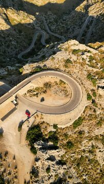 Aerial view of winding Sa Calobra Road with hairpin turns and zigzag patterns, Coll de Reis, Balearic Islands, Spain.