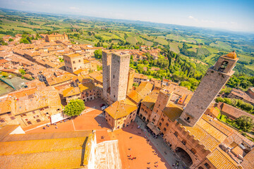 Naklejka premium Medieval San Gimignano hill town with skyline of medieval towers, including the stone Torre Grossa. Province of Siena, Tuscany, Italy.
