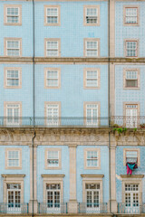 Typical facade of the buildings of the beautiful city of Porto, Portugal. With its typical tiles of Portugal, its windows, balconies and hanging clothes. Next to the Douro river.