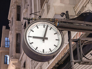 Large Public Clock Hanging Over Street in Istanbul Turkey