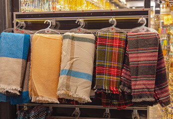 Colourful Modern Wool Shawls Wraps Hanging in Store