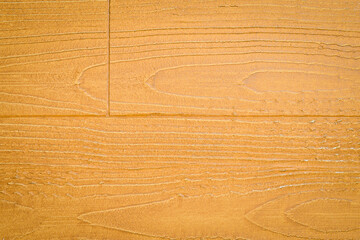 Decorative stone wall surface with imitation of wood. Textured surface.