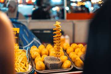 Fried spiralized potato skewers for sale at Street Food Market