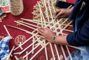 There are lots of handicraft products in our area such as making bags, food containers, fruit...