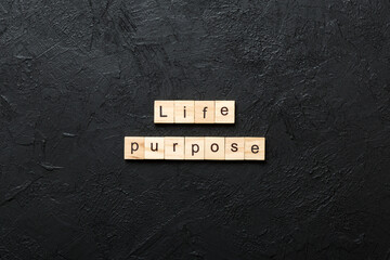 life purpose word written on wood block. life purpose text on cement table for your desing, concept