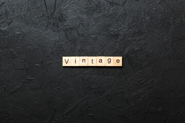 vintage word written on wood block. vintage text on cement table for your desing, concept