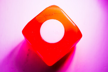 Vibrant Dice Showing One with purple hue