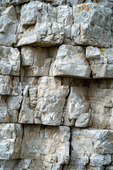 Fototapeta premium A photograph showing the variety of textures and colors in the limestone, from smooth, worn surfaces