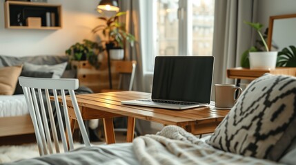 A light-colored Nordic-style home office desk featuring a mock-up laptop