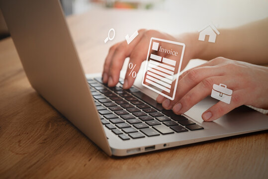 Man typing on a laptop. Invoice concept