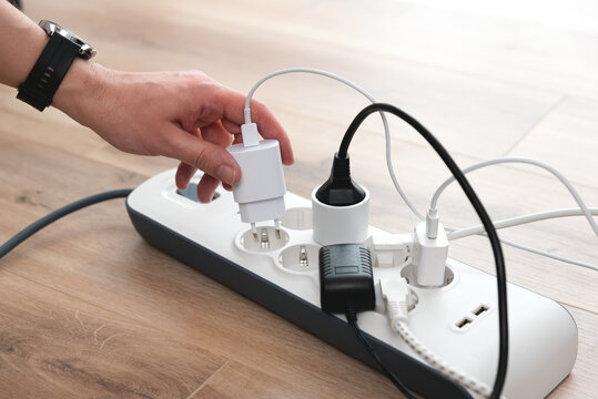 Power strip socket with connected plugs.