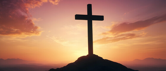 Panorama of Christian cross standing on mountains peak at sunrise