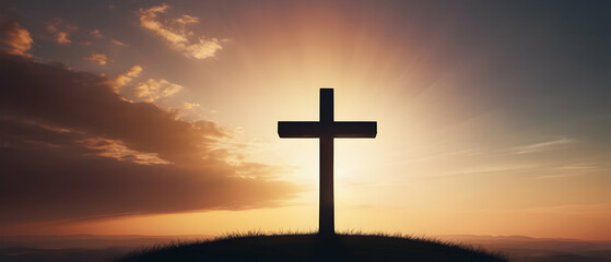 Fototapeta na wymiar Panorama of Christian cross standing on mountains peak at sunrise