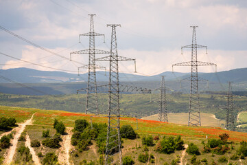 High voltage towers Electric pole. Power line support with wires for electricity transmission. High...