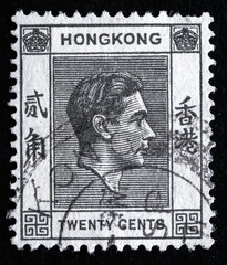 Ukraine, Kiyiv - February 3, 2024.A stamp printed in Hong Kong shows image of King George VI, circa...
