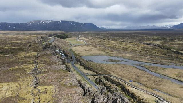 Breathtaking Tingvellir National Park in Iceland: aerial panorama of rugged cliffs and winding rivers, 4K aerial photography