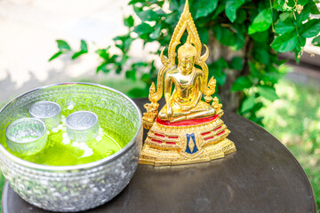 Background of Buddha statues used in the Buddha bathing ceremony on Songkran Day or making merit at...