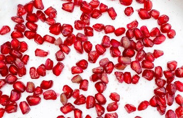 Top View of Pomegranate Seeds Scattered Isolated on White Background