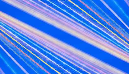 Converging Multi-colored Sewing Thread on a blue background