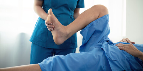 Healthcare, physiotherapist and patient with foot injury, stretching and recovery with treatment,...