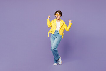 Full body young woman wear yellow shirt white t-shirt casual clothes glasses doing winner gesture...