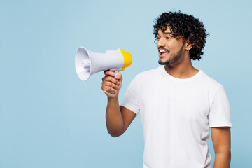 Young happy Indian man wear white t-shirt casual clothes hold in hand megaphone scream announces...