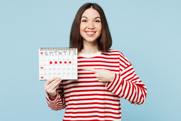 Young smiling happy woman wears red casual clothes hold point index finger on female periods pms...