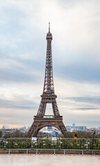 Fototapeta na wymiar PARIS, FRANCE - MARCH 30, 2024: Eiffel Tower seen from the Jardins du Trocadero in Paris, France. Eiffel Tower is one of the most iconic landmarks of Paris