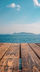 An empty wooden dock with the ocean in the background.