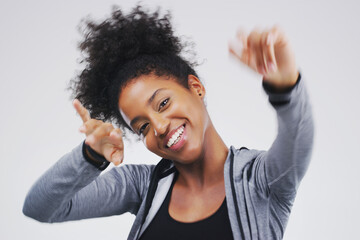 Dancing, happy and portrait of black woman in studio for celebration, winning prize or promotion on...