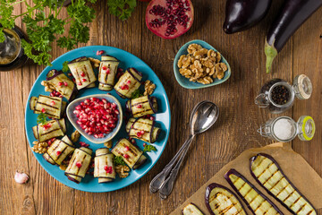 Delicious appetizer of grilled eggplants. Wrapped in rolls with nut paste. Served with pomegranates. - 788206681