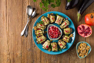 Delicious appetizer of grilled eggplants. Wrapped in rolls with nut paste. Served with pomegranates. - 788206684