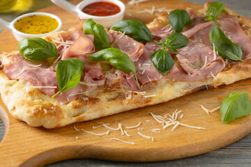 Traditional Roman pinsa with ham and basil. - 788209245