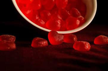 red candy hearts in a bowl