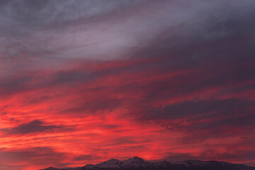 Fiery orange sunset sky. Beautiful sky. Mountain landscape