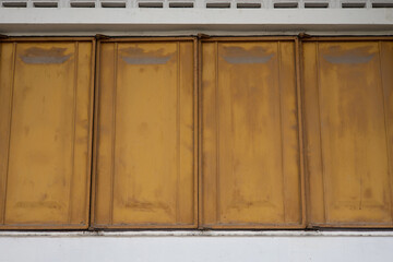 The windows are thick yellow iron panes.