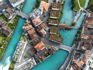 Interlaken, Switzerland: Aerial top down view of the Interlaken old town with the Aar river in...