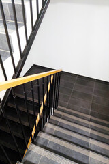 Black and White Staircase With Yellow Hand Rail - 788215283