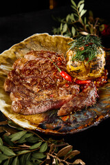 Gourmet Ribeye Steak with Roasted Potatoes on Elegant Platter - Fine Dining Experience - 788217075