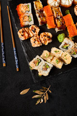 Diverse Sushi Rolls Platter Presentation on Black Stone - 'Сет из маки роллов' Theme - 788217455