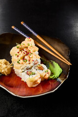 Gourmet Baked Salmon Roll with Spicy Sauce Served Elegantly on Dark Plate - 788217643