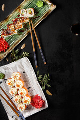 Gourmet Philadelphia and Canada Sushi Rolls on a Stylish Dinner Table