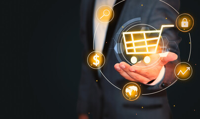 Businessman Showing E-Commerce concept with Shopping cart hovering above the hand, background with copy space. Online shopping banner - obrazy, fototapety, plakaty
