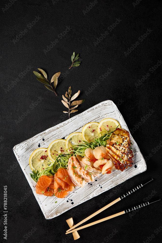 Sticker assorted sashimi platter with salmon, shrimp, scallop, and eel on elegant tableware