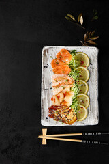 Diverse Group Enjoying Artisan Sashimi Platter at Trendy Sushi Restaurant - 788218013